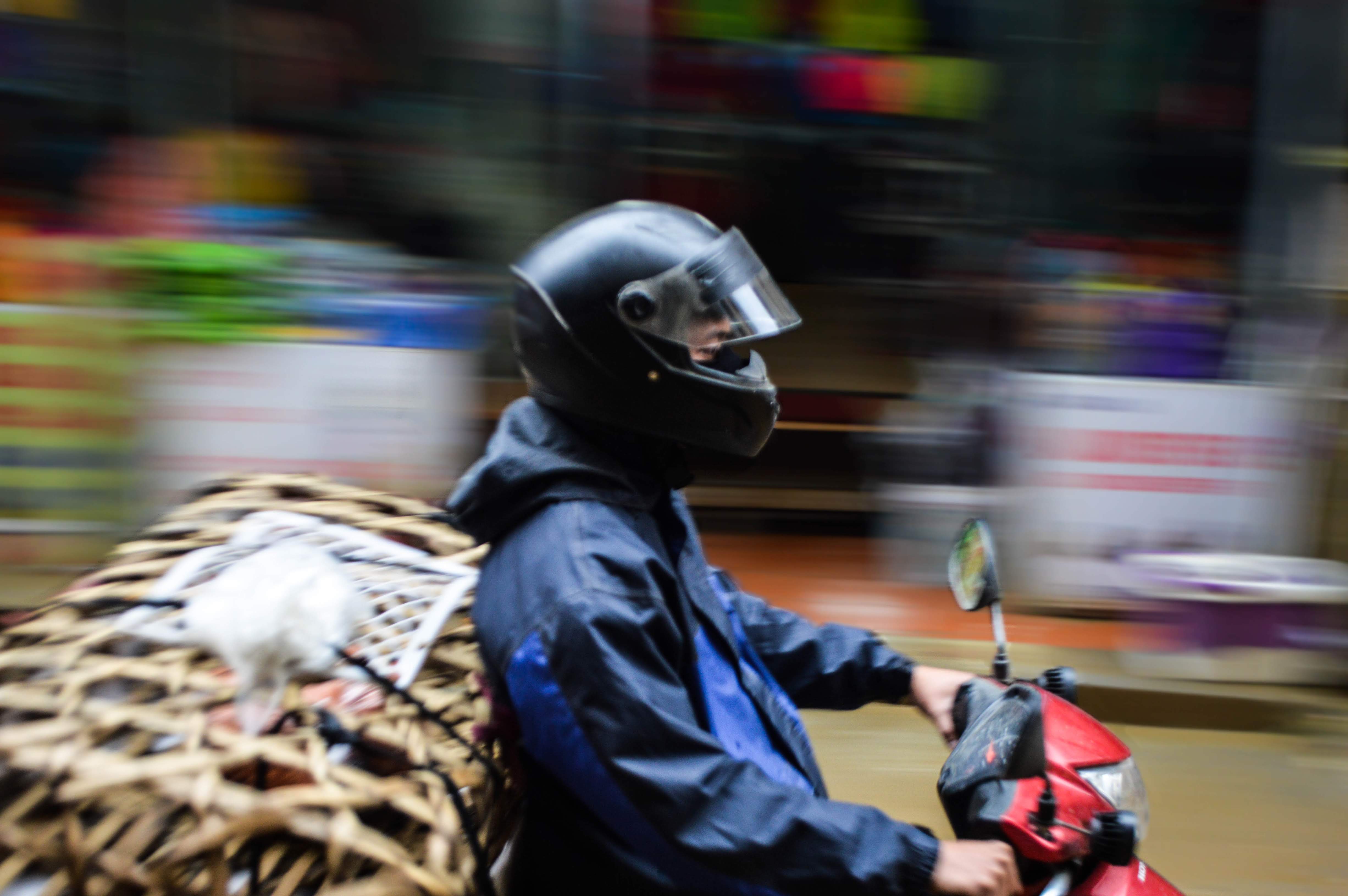 Vietnamese motorcyclist panning shot  
